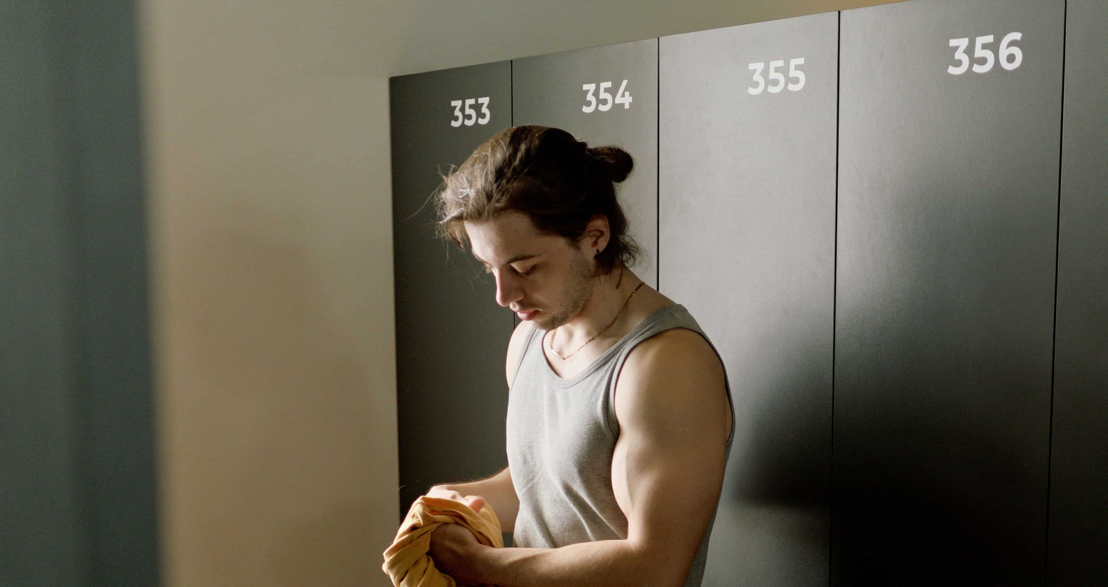 An athlete is in a locker room