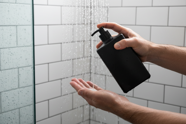 A close-up shot of hands applying body wash.