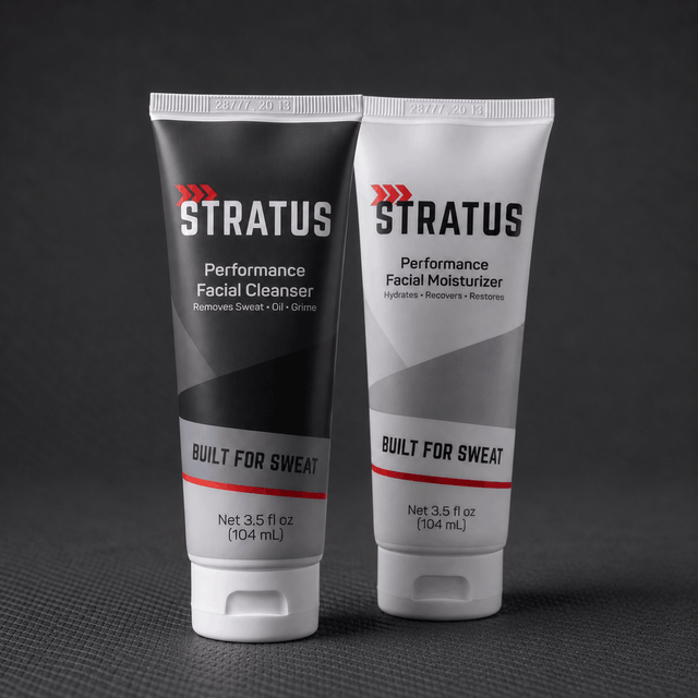 Two squeeze tubes that make up the Stratus Complete System, a post workout skincare routine, are shown on a dark background.